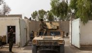 A member of Afghan Special Forces sits on the rooftop of his humvee as he arrives at the base after heavy clashes with Taliban during the rescue mission of a policeman besieged at a check post, in Kandahar province, Afghanistan, July 13, 2021. (REUTERS/Da