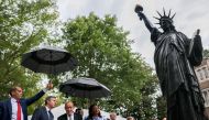 U.S. Secretary of State Antony Blinken and French Foreign Minister Jean-Yves Le Drian remark upon the unveiled model of the Statue of Liberty at the French Ambassador?s residence in Washington D.C., U.S., July 14, 2021. REUTERS/Evelyn Hockstein
