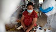 Public health officers prepare to administer a coronavirus disease (COVID-19) swab test as they bring testing to residents living in remote communities, amid the rise of coronavirus disease infections, in Samut Prakan, near Bangkok, Thailand, July 19, 202