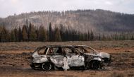 The remnants of cars destroyed by the Bootleg Fire are seen in a small community near Beatty, Oregon, U.S., July 19, 2021. REUTERS/David Ryder