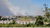 Smoke from a wildfire is seen in Manavgat, Antalya, Turkey July 28, 2021 in this still image taken from social media video. TWITTER/@ONURBURAKCELIK/via REUTERS