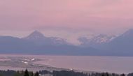 Vehicles evacuate Homer Spit following tsunami warning after a quake, in Homer, Alaska, U.S., July 28, 2021 in this still image obtained from a video on July 29, 2021. Brian Hudson/via REUTERS