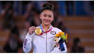 Gold medallist Sunisa Lee of the United States poses on the podium. REUTERS/Dylan Martinez