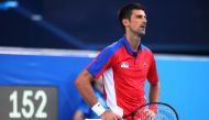 Novak Djokovic of Serbia reacts during his bronze medal match against Pablo Carreno of Spain (REUTERS/Edgar Su)
