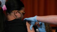 Ariel Quero (16) receives a dose of the Pfizer-BioNTech COVID-9 vaccine at a vaccination clinic at Lehman High School in the Bronx borough of New York City, US, on July 27, 2021. Reuters/File Photo