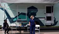 Nurses wait for people to come by to receive their coronavirus disease (COVID-19) vaccine at a mobile pop-up vaccination clinic hosted by the Detroit Health Department with the Detroit Public Schools Community District at East English Village Preparatory 