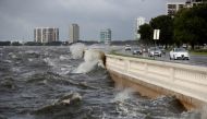 Waves crash the balustrades on Bayshore Boulevard during high tide after Tropical Storm Elsa churns up the Gulf coast, in Tampa, Florida, U.S., July 7, 2021. REUTERS/Octavio Jones/File Photo