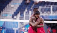 Qatar's Ahmed Tijan shoots to score against Italy’s Paolo Nicolai and Daniele Lupo during their quarter-final match yesterday.