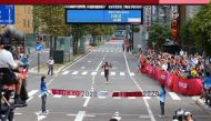 Eliud Kipchoge of Kenya moments before crossing the finish line to win gold Reuters/Feline Lim