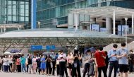 People wait in line for a coronavirus disease (COVID-19) test at a testing site, temporarily set up at a railway station in Seoul, South Korea, July 7, 2021. REUTERS/ Heo Ran/File Photo