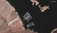 An aerial view shows the Hemenway Harbor boat launch area on Lake Mead and Hoover Dam on the Colorado River, U.S. May 18, 2020. SATELLITE IMAGE 2021 MAXAR TECHNOLOGIES/Handout via REUTERS