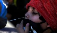 A young boy is tested for the coronavirus disease (COVID-19) at a mobile testing site as the country sees an increase in children infected with COVID-19, in Houston, Texas, U.S., August 16, 2021. Reuters/Callaghan O'Hare/File Photo