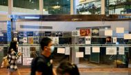 Student walk past the Hong Kong University Students' Union (HKUSU) office at the Hong Kong University in Hong Kong, China May 2, 2021. Reuters/Tyrone Siu