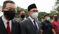 Malaysia opposition leaders Anwar Ibrahim and Lim Guan Eng leave National Palace after meeting with the King, in Kuala Lumpur, Malaysia August 17, 2021. Reuters/Lim Huey Teng
