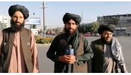 A man holds a wireless microphone as he speaks on the street in Kabul, Afghanistan, in this still image taken from social media video uploaded August 16, 2021.