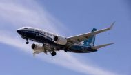 A Boeing 737 MAX airplane lands after a test flight at Boeing Field in Seattle, Washington, U.S. June 29, 2020. REUTERS/Karen Ducey/File Photo

