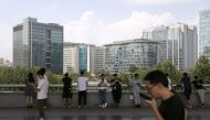 People are seen at Beijing's tech hub Zhongguancun, China August 23, 2021. REUTERS/Tingshu Wang

