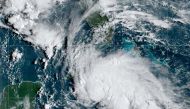 A satellite image shows Tropical Storm Ida after forming in the Caribbean, about 75 miles (125 kilometers) north-northwest of Grand Cayman, August 27, 2021. NOAA/Handout via REUTERS