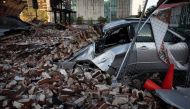A destroyed car is seen under the debris of a building after Hurricane Ida made landfall in Louisiana, U.S., August 31, 2021. REUTERS/Marco Bello
