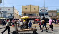 A man pushes a trolley in a busy market amid the coronavirus pandemic, in downtown Kingston, Jamaica September 2, 2021. Picture taken September 2, 2021. REUTERS/Kate Chappell 