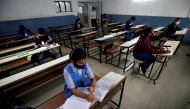 Students wearing protective face masks attend their class as they maintain social distancing in Ahmedabad, India, January 11, 2021. Reuters/Amit Dave/File Photo