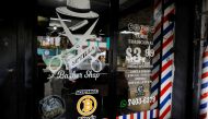 A Bitcoin logo is seen outside at Sevilla Barber Shop where Bitcoin is accepted as a payment method in Santa Tecla, El Salvador September 6, 2021. Reuters/Jose Cabezas