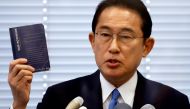 File photo: Fumio Kishida, Japan's ruling Liberal Democratic Party (LDP) lawmaker and former foreign minister, shows his notebook during a news conference as he announces his candidacy for the party's presidential election in Tokyo, Japan August 26, 2021.