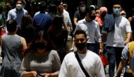 Office workers spend their lunch breaks at the central business district amid the COVID-19 outbreak in Singapore, September 8, 2021. REUTERS/Edgar Su