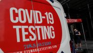 A woman wearing a protective face mask waits at a coronavirus disease (COVID-19) mobile testing site amid the COVID-19 pandemic in the Midtown Manhattan area of New York City, U.S., September 15, 2021. REUTERS/Shannon Stapleton
