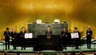 (L to R) Taehyung/V, Suga, Jin, RM, Jungkook, Jimin and J-Hope of South Korean boy band BTS speak at the SDG Moment event as part of the UN General Assembly 76th session General Debate in UN General Assembly Hall at the United Nations Headquarters, in New