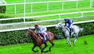 Al Shaqab Racing's Caracal (left) heads towards win. 