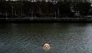 A fibreglass sculpture entitled 'Bihar' (Tomorrow in Basque), by Mexican hyperrealist artist Ruben Orozco, is submerged in the Nervion river in Bilbao, Spain, September 27, 2021. REUTERS/Vincent West TPX IMAGES OF THE DAY