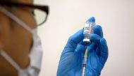 Medical staff prepare Moderna coronavirus (COVID-19) vaccine to be administered at newly-opened mass vaccination centre in Tokyo, Japan, May 24, 2021. Carl Court/Pool via REUTERS