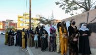 Voters stand in line at a polling station in Duhok, Iraq, October 10, 2021. Reuters/Ari Jalal