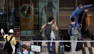 Passengers from Amsterdam arrive at Changi Airport under Singapore’s expanded Vaccinated Travel Lane (VTL) quarantine-free travel scheme, as the city-state opens its borders to more countries amidst the coronavirus disease (COVID-19) pandemic, in Singapor