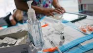 A nurse prepares to administer a dose of the Pfizer-BioNTech vaccine for the coronavirus disease (COVID-19), at a mobile inoculation site in the Bronx borough of New York City, New York, U.S., August 18, 2021. REUTERS/David 'Dee' Delgado

