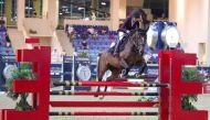 Haya Khalid Al Hitmi guides Dusty over a hurdle during yesterday's Small Tour competition.