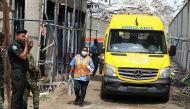 Rescue personnel work near a collapsed building in Ikoyi, Lagos, Nigeria, November 2, 2021. REUTERS/Temilade Adelaja