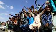 FILE PHOTO: Protesters gesture and shout slogans as they demonstrate against the Sudanese military's recent seizure of power and ousting of the civilian government, in the capital Khartoum, Sudan October 30, 2021. REUTERS/Mohamed Nureldin