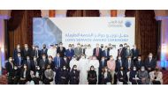 Ahlibank officials with employees pose for a group photo during the award ceremony.