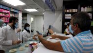 Customers buy medication inside a pharmacy in Beirut, Lebanon November 17, 2021. Picture taken November 17, 2021. Reuters/Mohamed Azakir