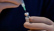 A healthcare worker prepares a dose of the Pfizer/BioNTech coronavirus disease (COVID-19) vaccine, which was authorized by Canada to be used for children aged 12 to 15, at Woodbine Racetrack pop-up vaccine clinic in Toronto, Ontario, Canada May 5, 2021. REUTERS/Carlos Osorio

