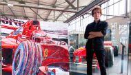 Renowned painter and official artist of Formula 1, Armin Flossdorf, with his artworks.