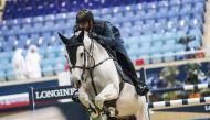Mohammed Saeed Haidan guides Miss Chili over a fence in this file photo.