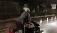 Green Party MP Julie Anne Genter rides a bicyle to the hospital while in labour, in Wellington, New Zealand, November 28, 2021, in this picture obtained from social media. Mandatory credit JULIE ANNE GENTER / FACEBOOK /via REUTERS