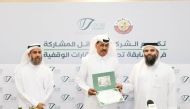 Director of General Administration of Endowments, Dr. Sheikh Khalid bin Mohamed bin Ghanem Al Thani, honouring a winner.
