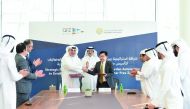 Minister of State and Chairman of QFZA H E Ahmad Al Sayed, President and CEO of Alfardan Group Omar Hussain Alfardan, CEO of QFZA Lim Meng Hui, and several senior officials from QFZA and Alfardan Automotive, during the agreement signing ceremony, recently.  