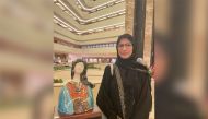 Qatari artist Haifa Al Khuzai with one of her ceramic pieces during the art exhibition “Al Naghda: Elegance from the past,” being held at Sheraton Grand Doha.  Pic: Joelyn Baluyut/The Peninsula
