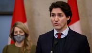 Canada's Prime Minister Justin Trudeau, with Minister of Foreign Affairs Melanie Joly, speaks during a press conference on Parliament Hill in Ottawa, Ontario, Canada, December 8, 2021. Reuters/Blair Gable