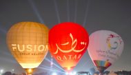 Hot air balloons are inflated during the 2nd Qatar Balloon Festival at Aspire Park, yesterday. Pic: Abdul Basit